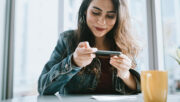 Smiling woman using her smart phone