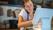 woman in shop using point of sale computer