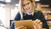 Smiling woman using a tablet device